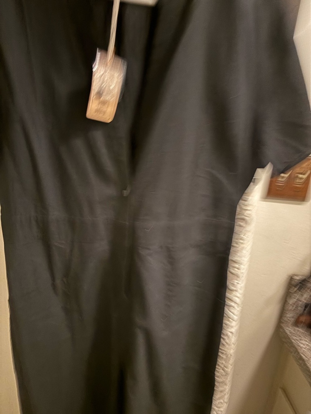 Black buttoned down jumpsuit with Short Sleeves. Roomy and wide leg. Never worn
